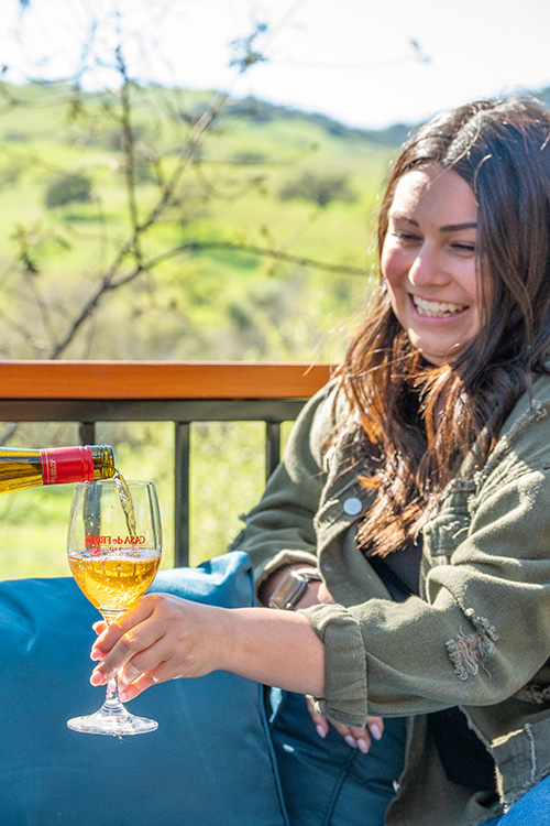 Pouring a glass of Casa de Fruta wine